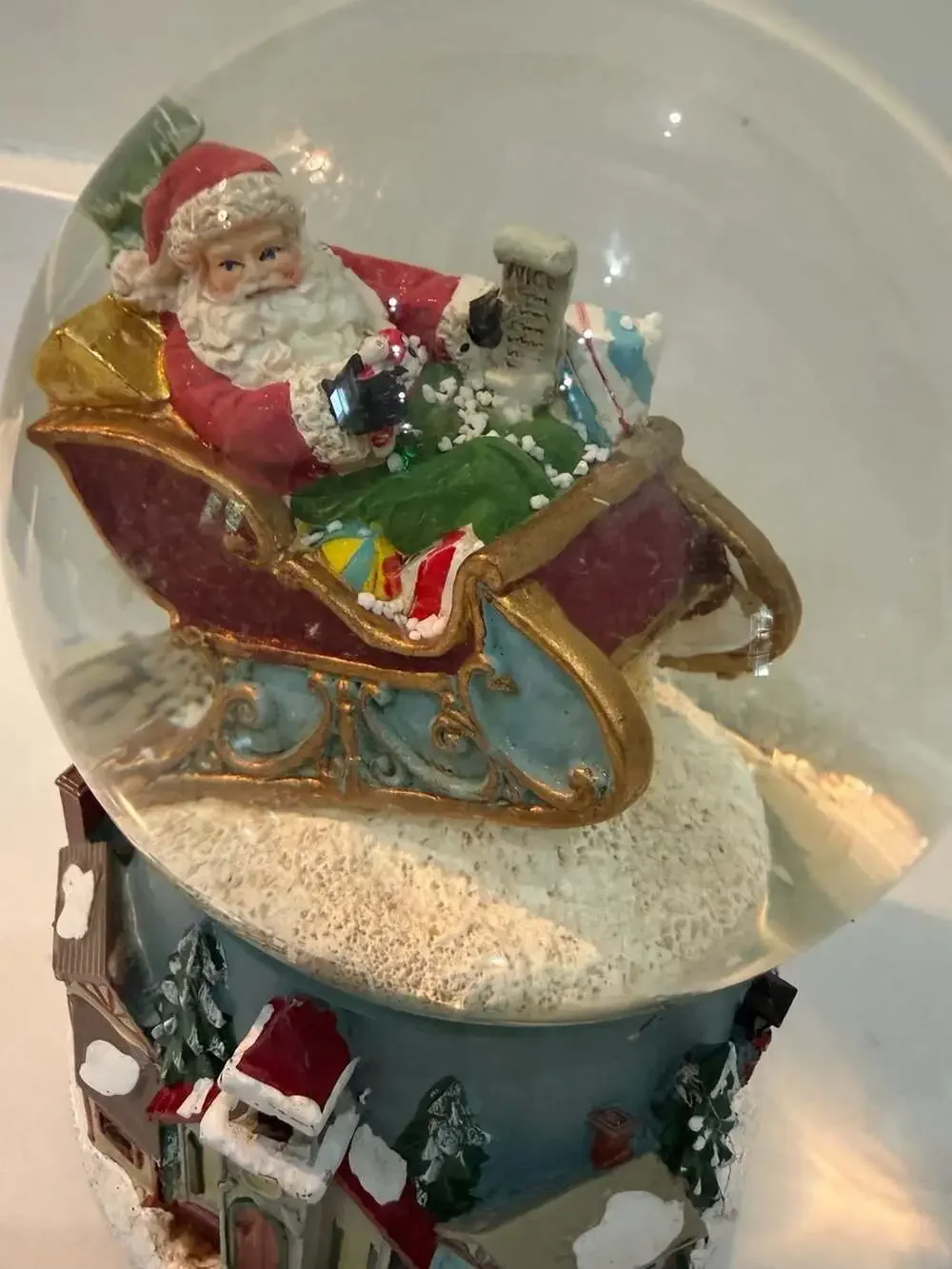 Roman Santa in Sleigh Musical Glitter Snow Globe with Winter Village Base